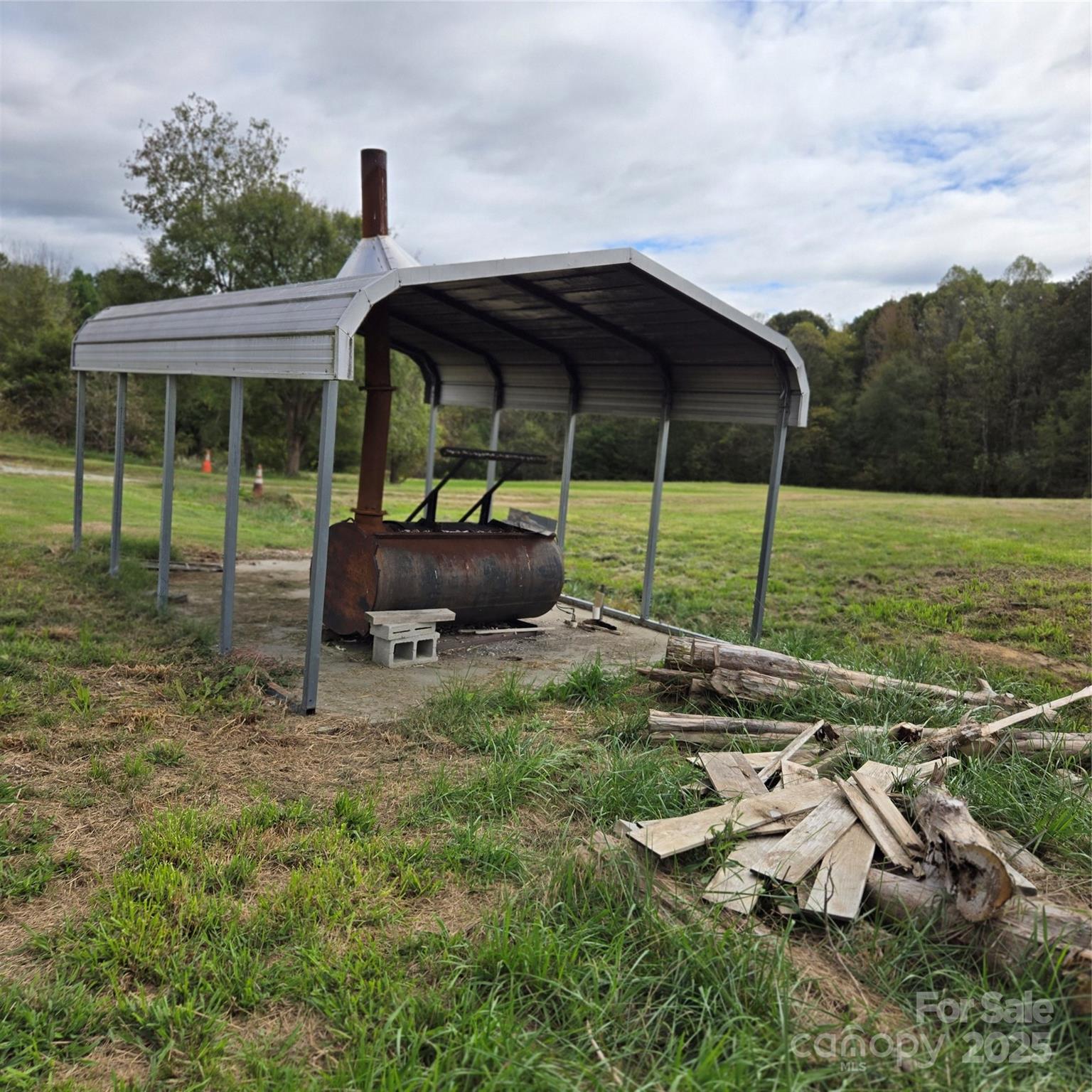2955 Wrenn Road Prospect Hill, NC 27314 - Photo 15 of 18 a backyard of a house with table and chairs