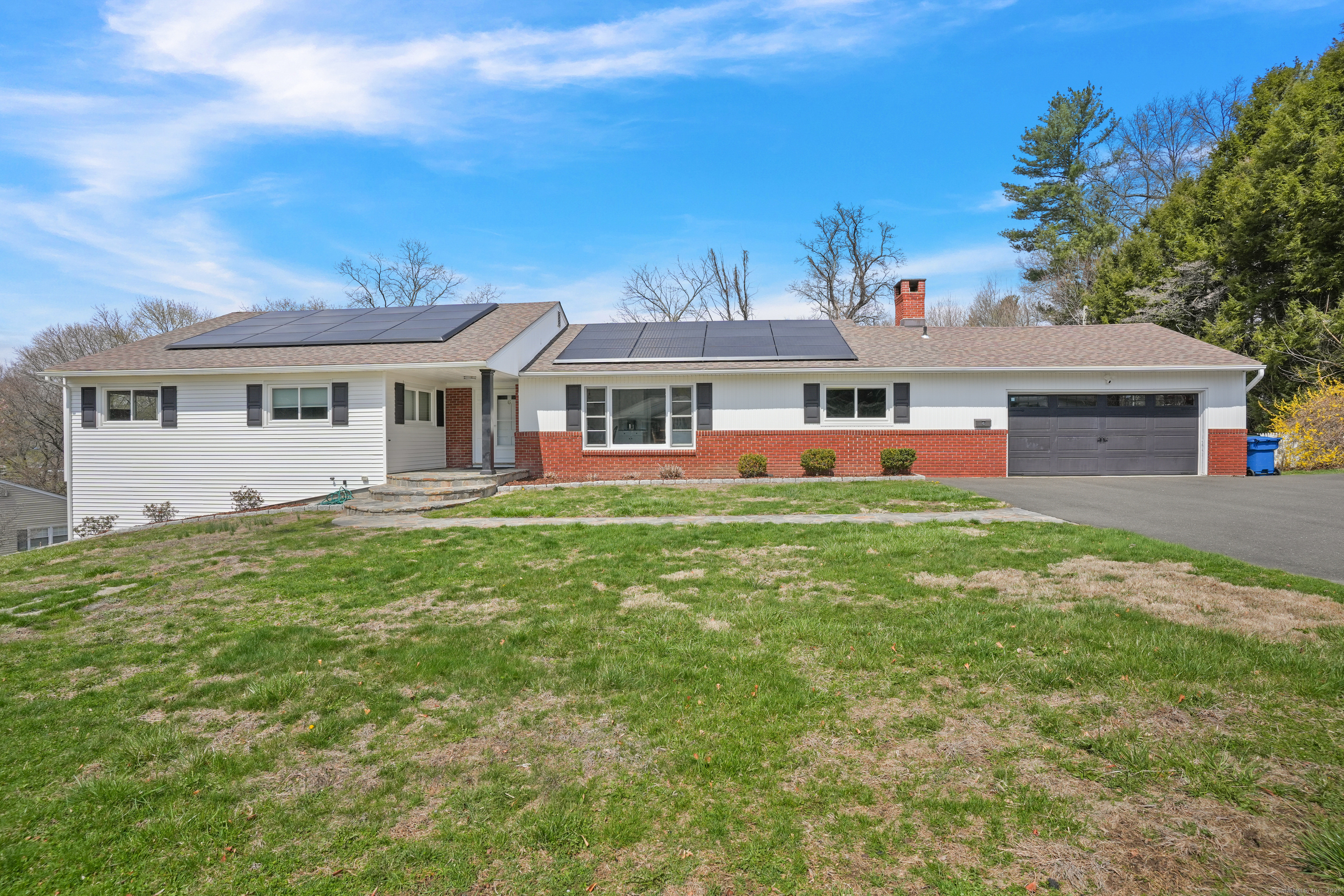 a front view of a house with a yard