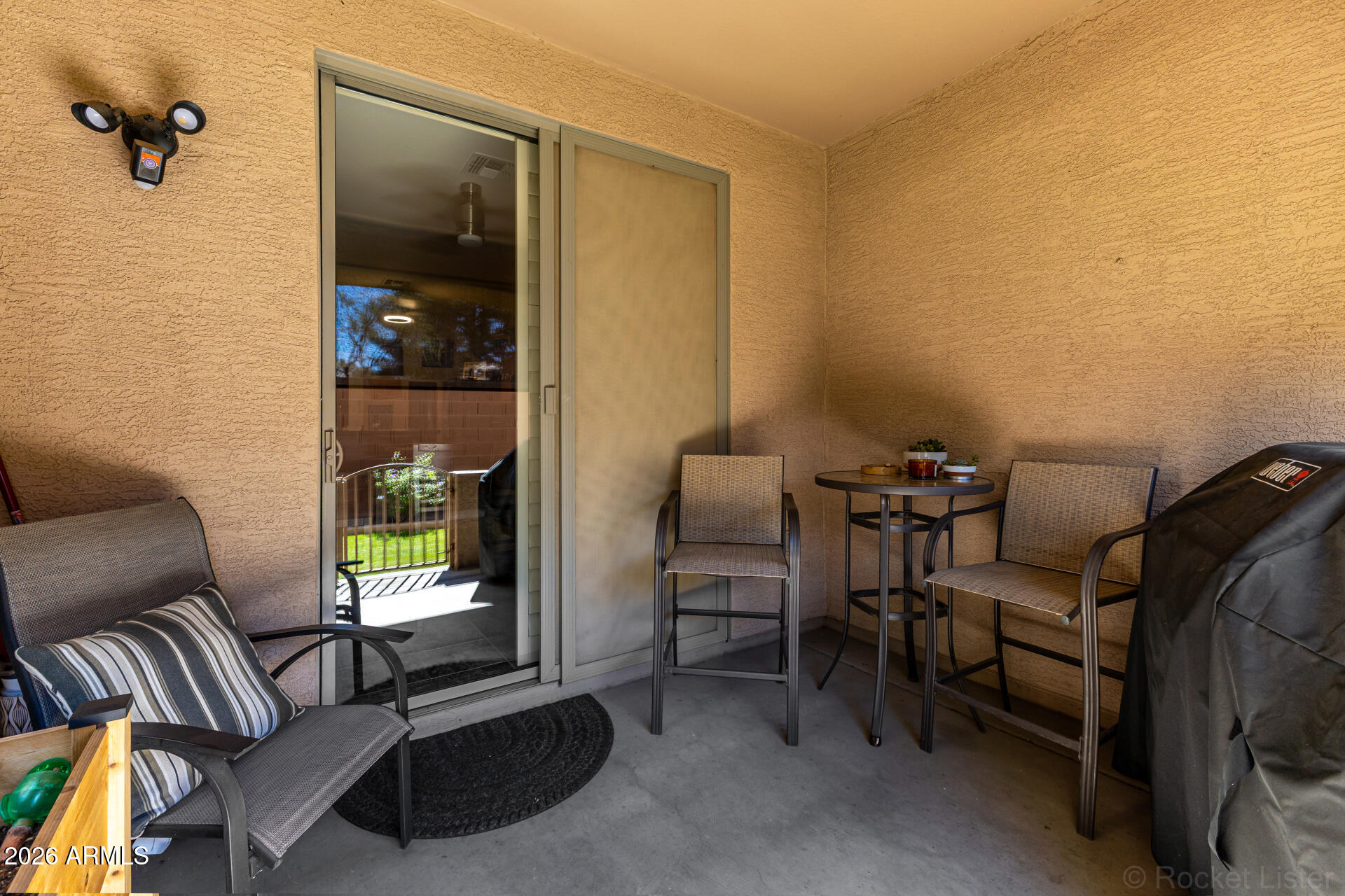 2600 East Springfield Place, Unit 109 Chandler, AZ 85286 - Photo 26 of 38 a living room with furniture and a window