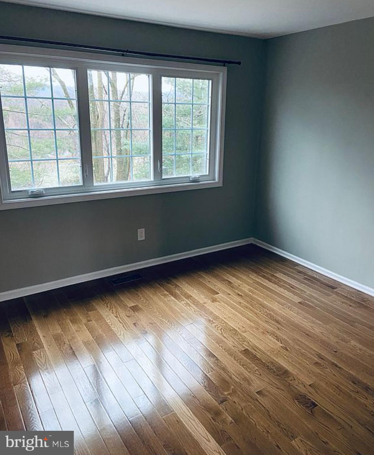 52 Cabot Drive Chesterbrook, PA 19087 - Photo 12 of 15 a view of an empty room with wooden floor and a window