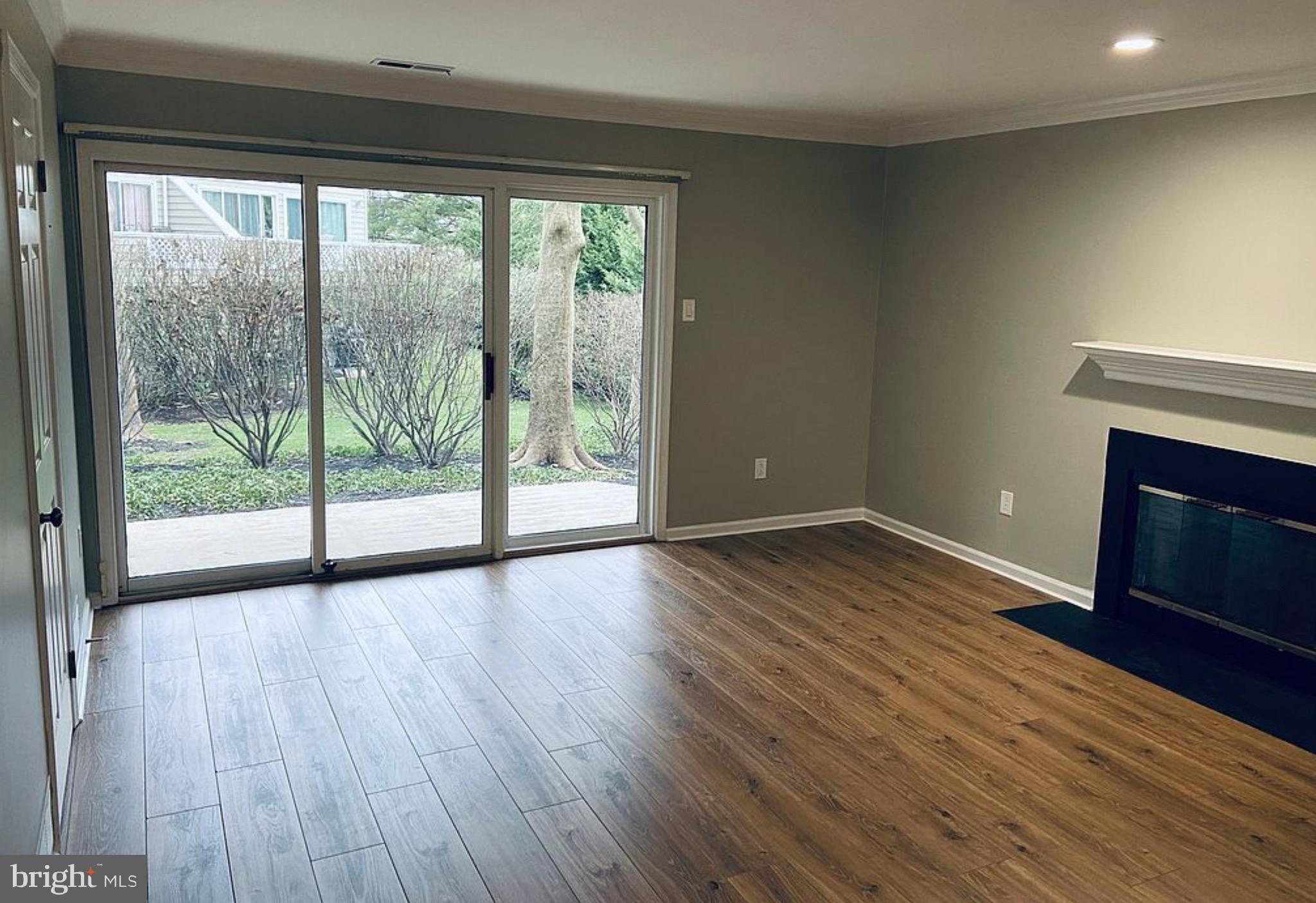 52 Cabot Drive Chesterbrook, PA 19087 - Photo 14 of 15 a view of empty room with wooden floor and fireplace