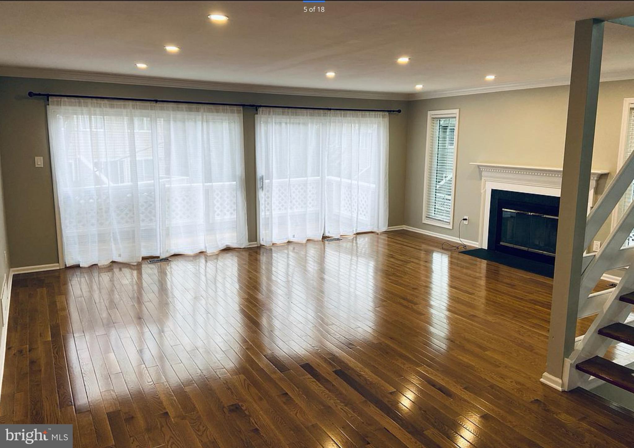 52 Cabot Drive Chesterbrook, PA 19087 - Photo 3 of 15 a view of an empty room with wooden floor and a window