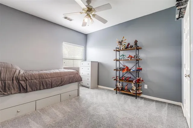 a bedroom with furniture and a chandelier