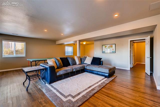 11974 Rio Secco Road Peyton, CO 80831 - Photo 17 of 29 Family/rec room with plank vinyl flooring.