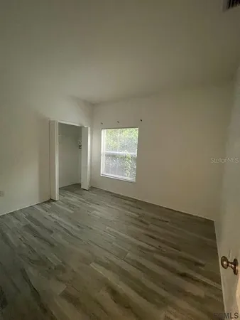 a view of an empty room and window