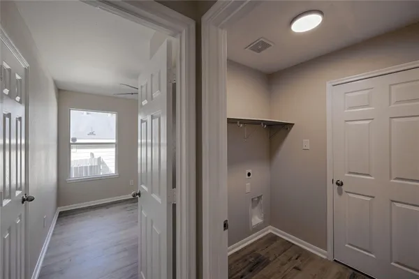 wooden floor and closet in a bathroom