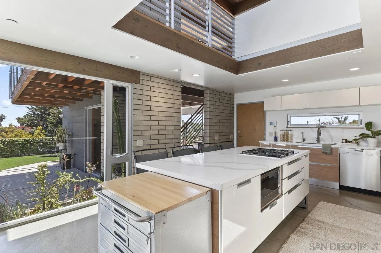 1635 Gascony Road Encinitas, CA 92024 - Photo 20 of 41 a kitchen that has a stove and a table