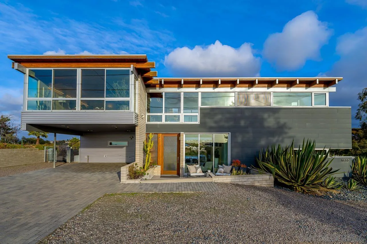1635 Gascony Road Encinitas, CA 92024 - Photo 30 of 41 a front view of a house with a garden