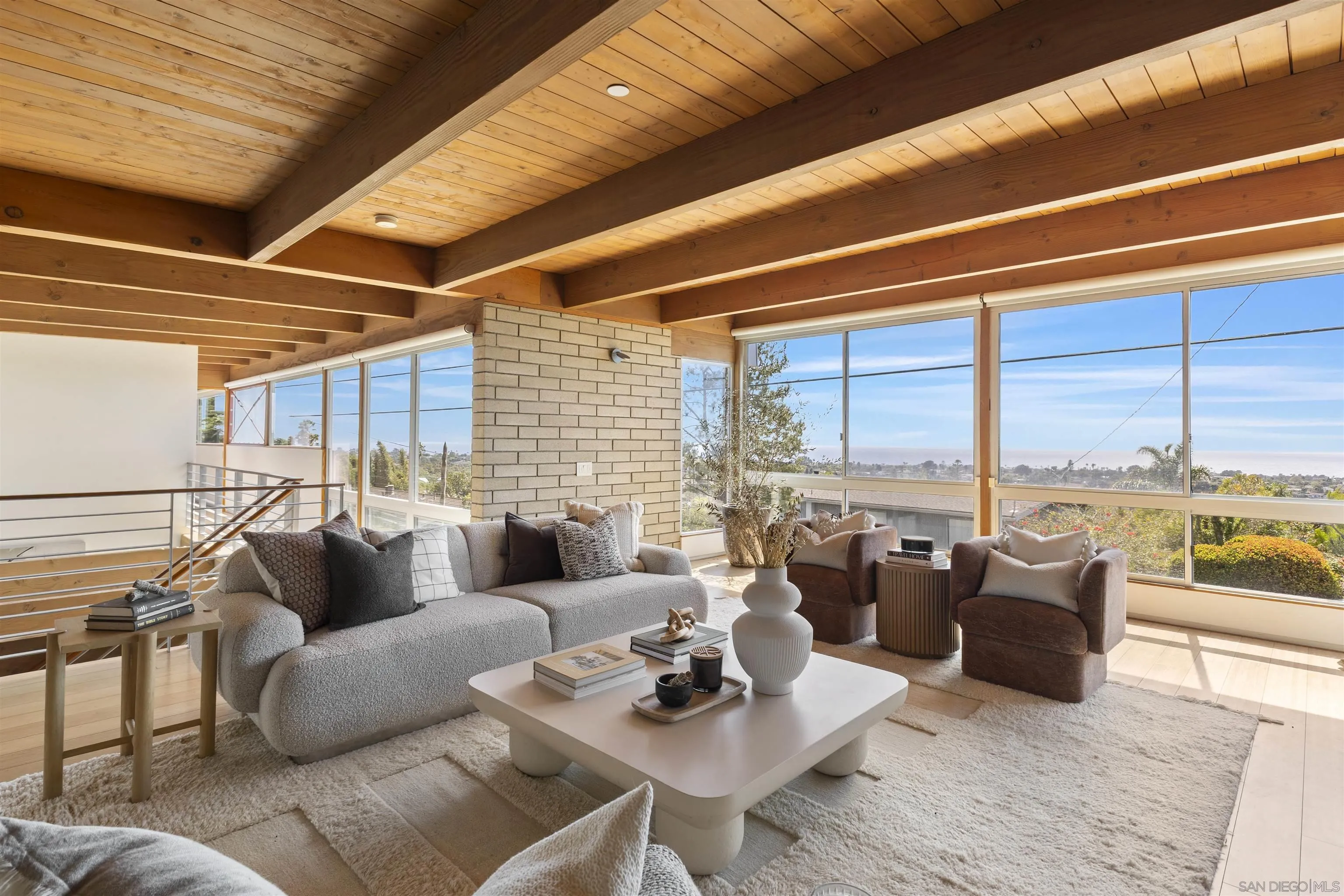 1635 Gascony Road Encinitas, CA 92024 - Photo 3 of 41 a living room with furniture and floor to ceiling windows