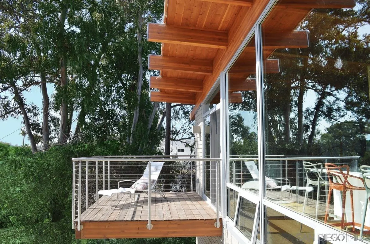 1635 Gascony Road Encinitas, CA 92024 - Photo 35 of 41 a view of a deck with two chair and wooden floor