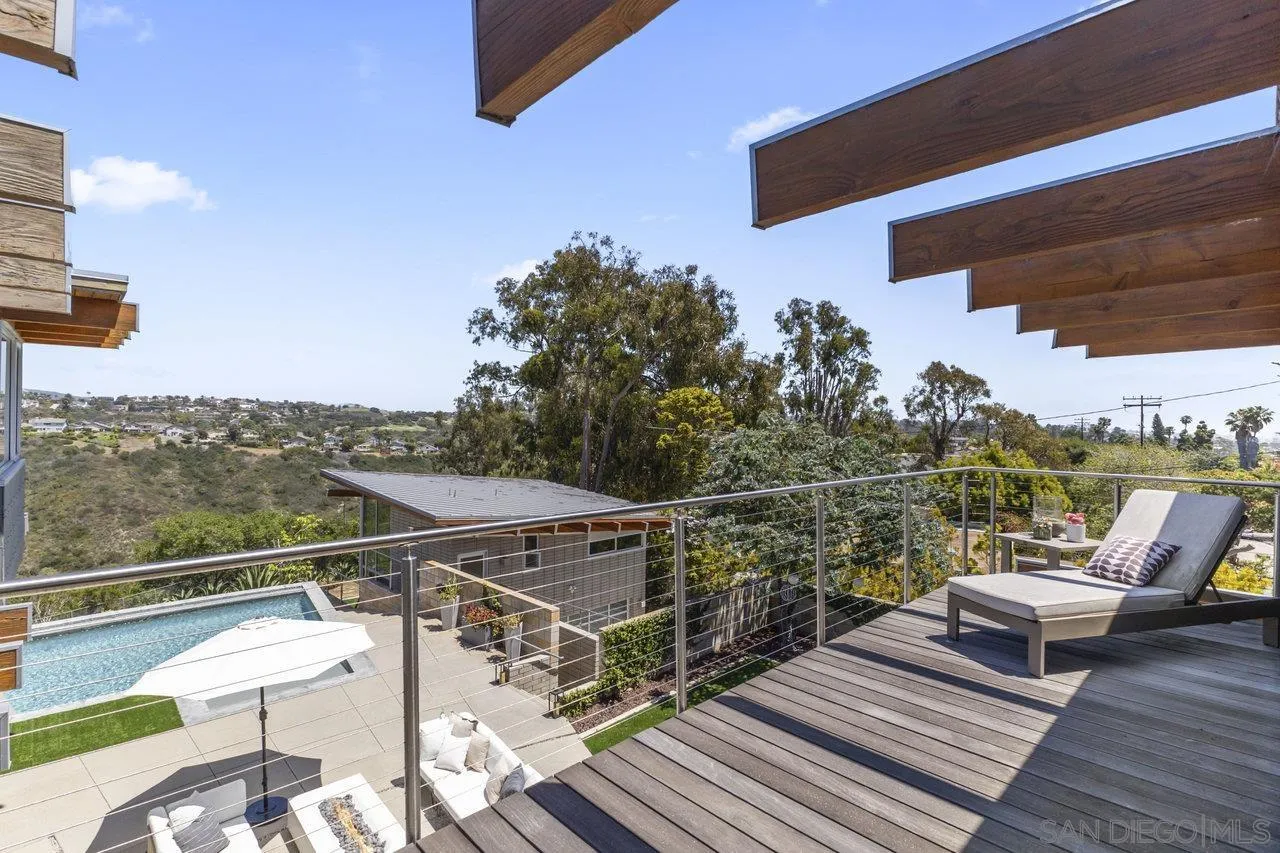 1635 Gascony Road Encinitas, CA 92024 - Photo 9 of 41 a view of a roof deck with couches and wooden floor