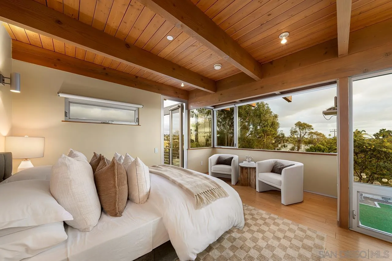 1635 Gascony Road Encinitas, CA 92024 - Photo 10 of 41 a bedroom with furniture and a large window