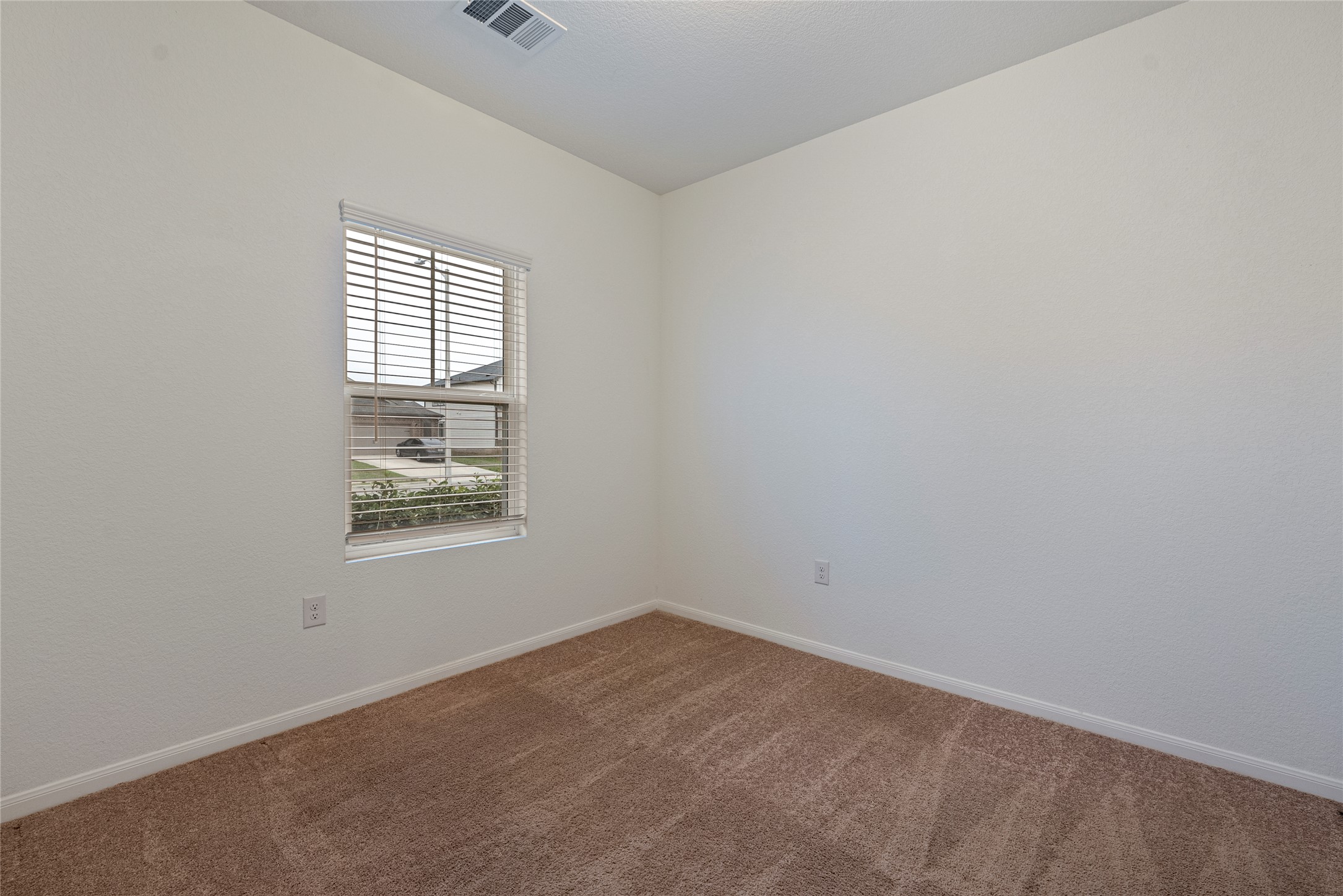 149 Biscayne Drive Kyle, TX 78640 - Photo 17 of 20 an empty room with windows