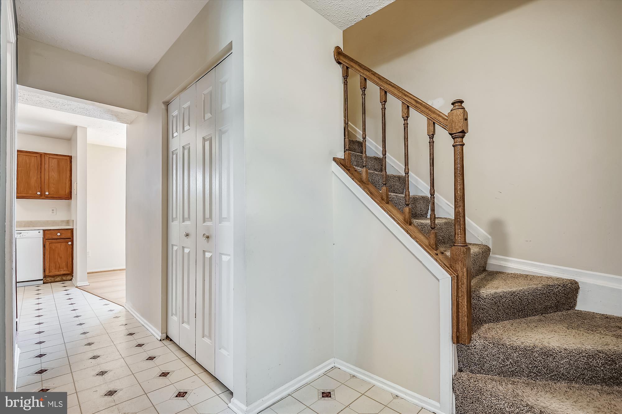 1210 Hunter Road Pasadena, MD 21122 - Photo 19 of 42 Front foyer and stairs to upper level