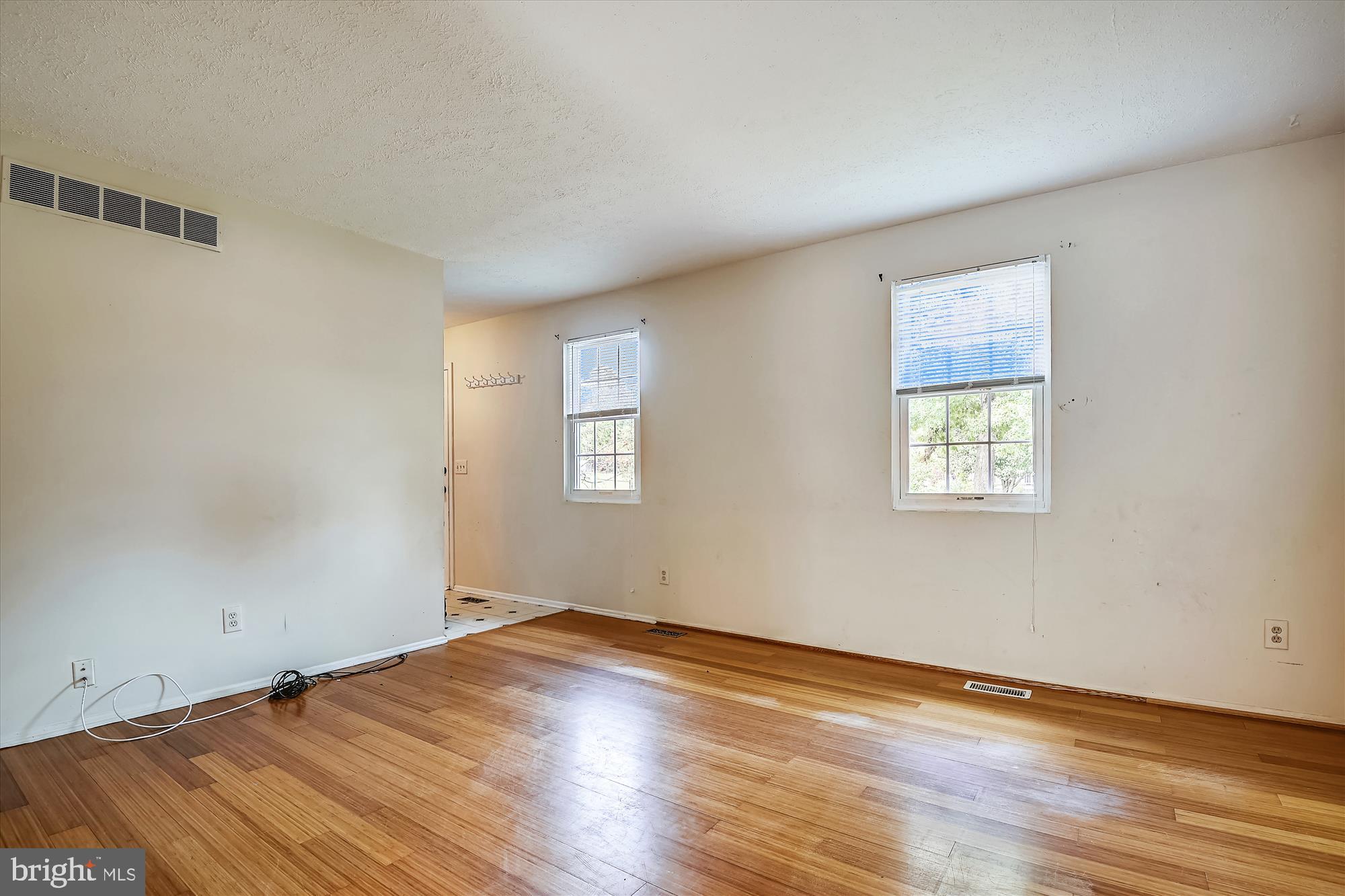 1210 Hunter Road Pasadena, MD 21122 - Photo 9 of 42 The Living room offers hardwood floors