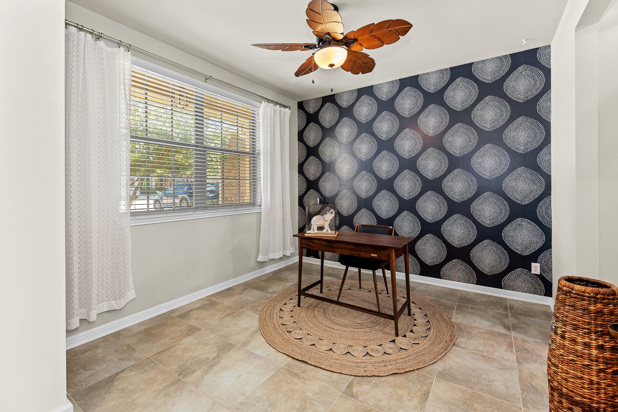 2813 Granite Hill Cove Leander, TX 78641 - Photo 6 of 39 Home office featuring wallpapered wall, as an accent wall. Previously staged with furniture.