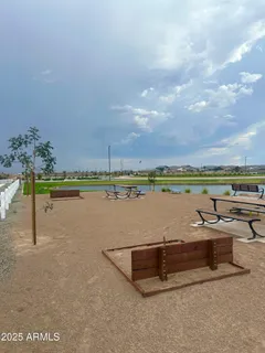 a view of a lake with houses in the back