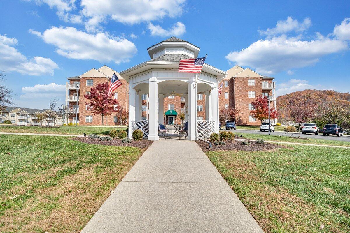 4444 Pheasant Ridge Road, Unit 207 Roanoke, VA 24014 - Photo 13 of 49 a view of a building with a yard