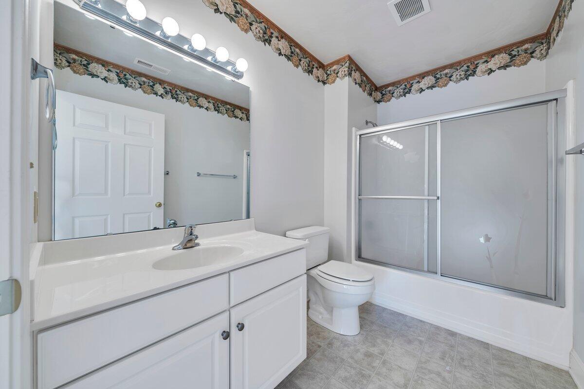 4444 Pheasant Ridge Road, Unit 207 Roanoke, VA 24014 - Photo 19 of 49 a bathroom with a sink a toilet and shower