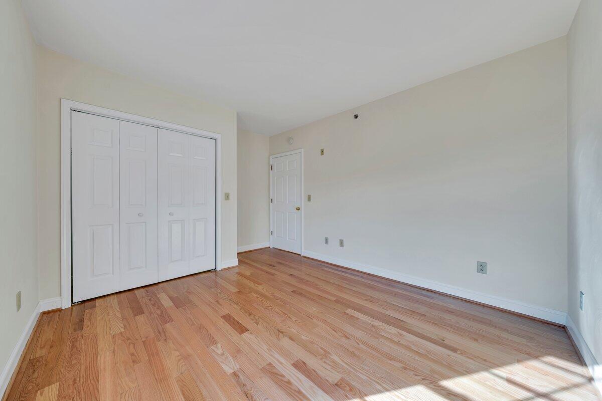 4444 Pheasant Ridge Road, Unit 207 Roanoke, VA 24014 - Photo 20 of 49 a view of empty room with wooden floor