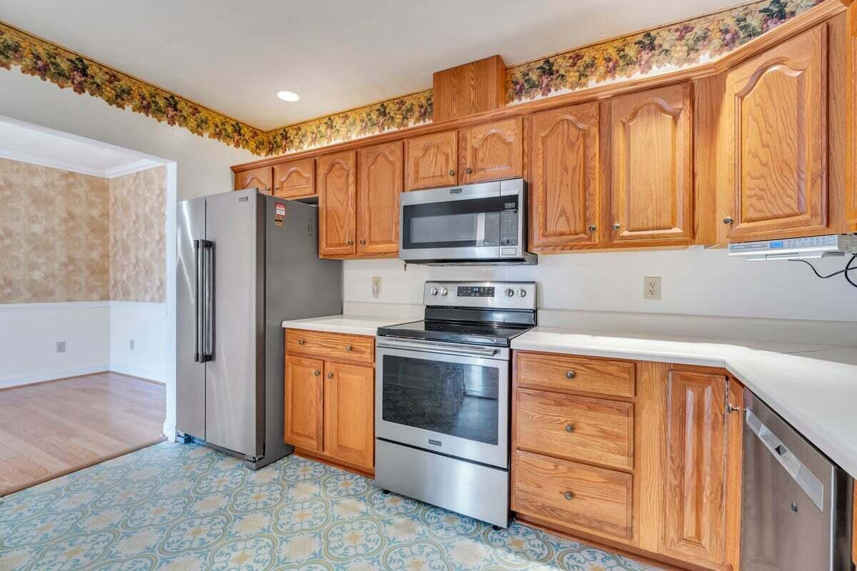 4444 Pheasant Ridge Road, Unit 207 Roanoke, VA 24014 - Photo 28 of 49 a kitchen with stainless steel appliances granite countertop a refrigerator stove and sink