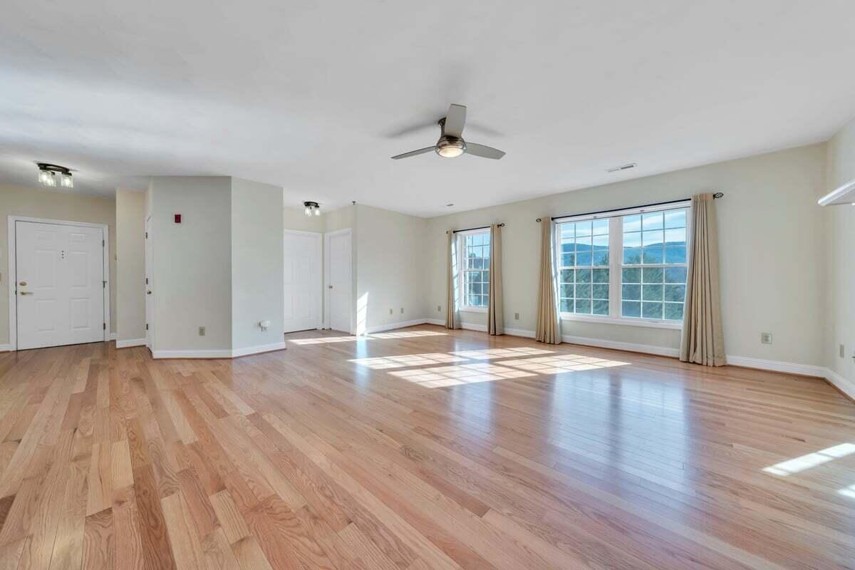4444 Pheasant Ridge Road, Unit 207 Roanoke, VA 24014 - Photo 42 of 49 a view of empty room with wooden floor and fan