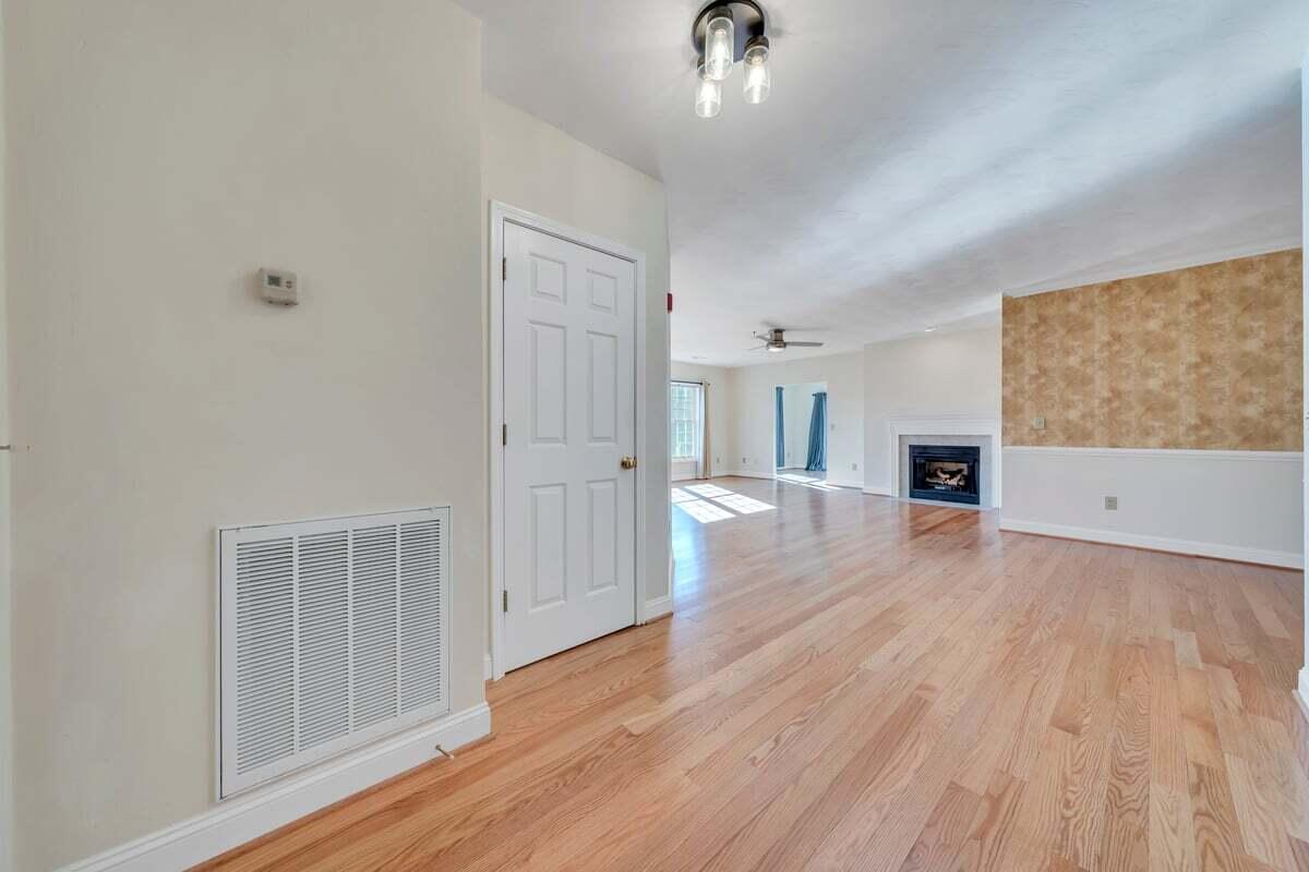 4444 Pheasant Ridge Road, Unit 207 Roanoke, VA 24014 - Photo 46 of 49 wooden floor in an empty room with a window