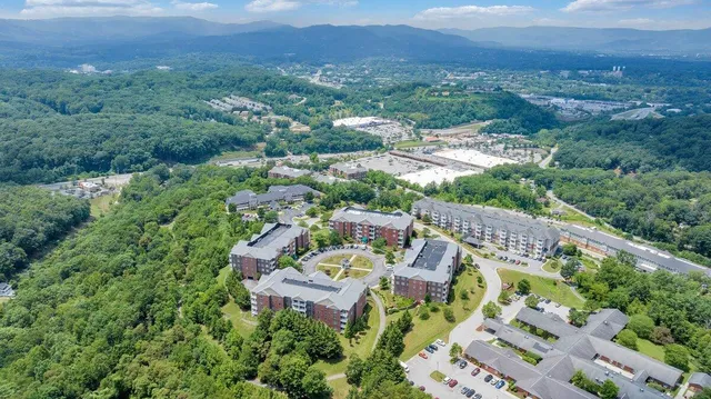 an aerial view of a house with a garden