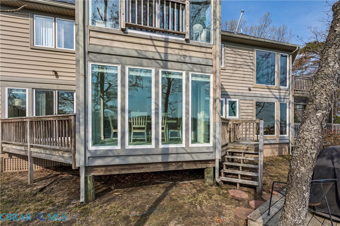 172 Sturgeon Creek Road Deltaville, VA 23043 - Photo 10 of 50 View of side of home featuring a deck and a balcony