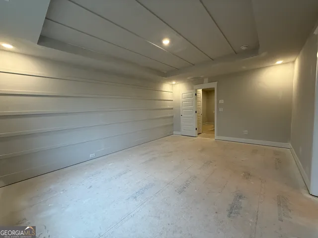 a bathroom with a double vanity sink a toilet and mirror
