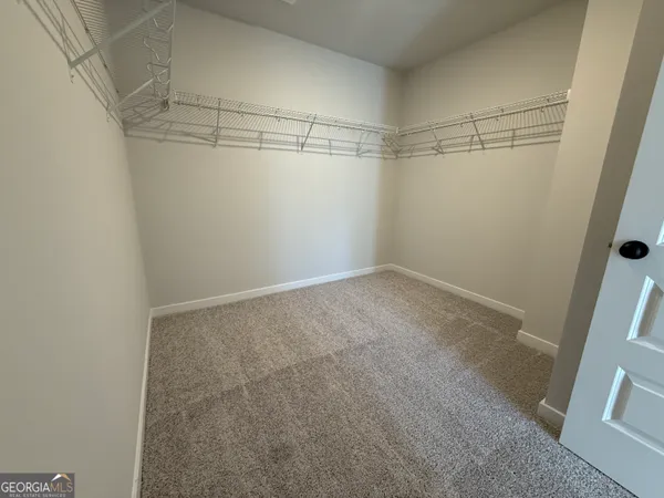 a view of a room with racks on the wall