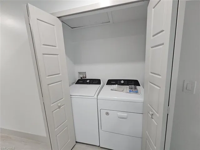 a utility room with dryer and washer