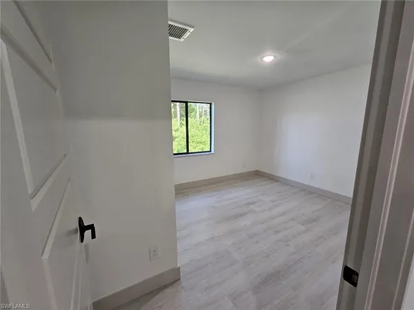 an empty room with windows