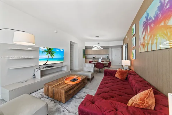 a living room with furniture and a flat screen tv