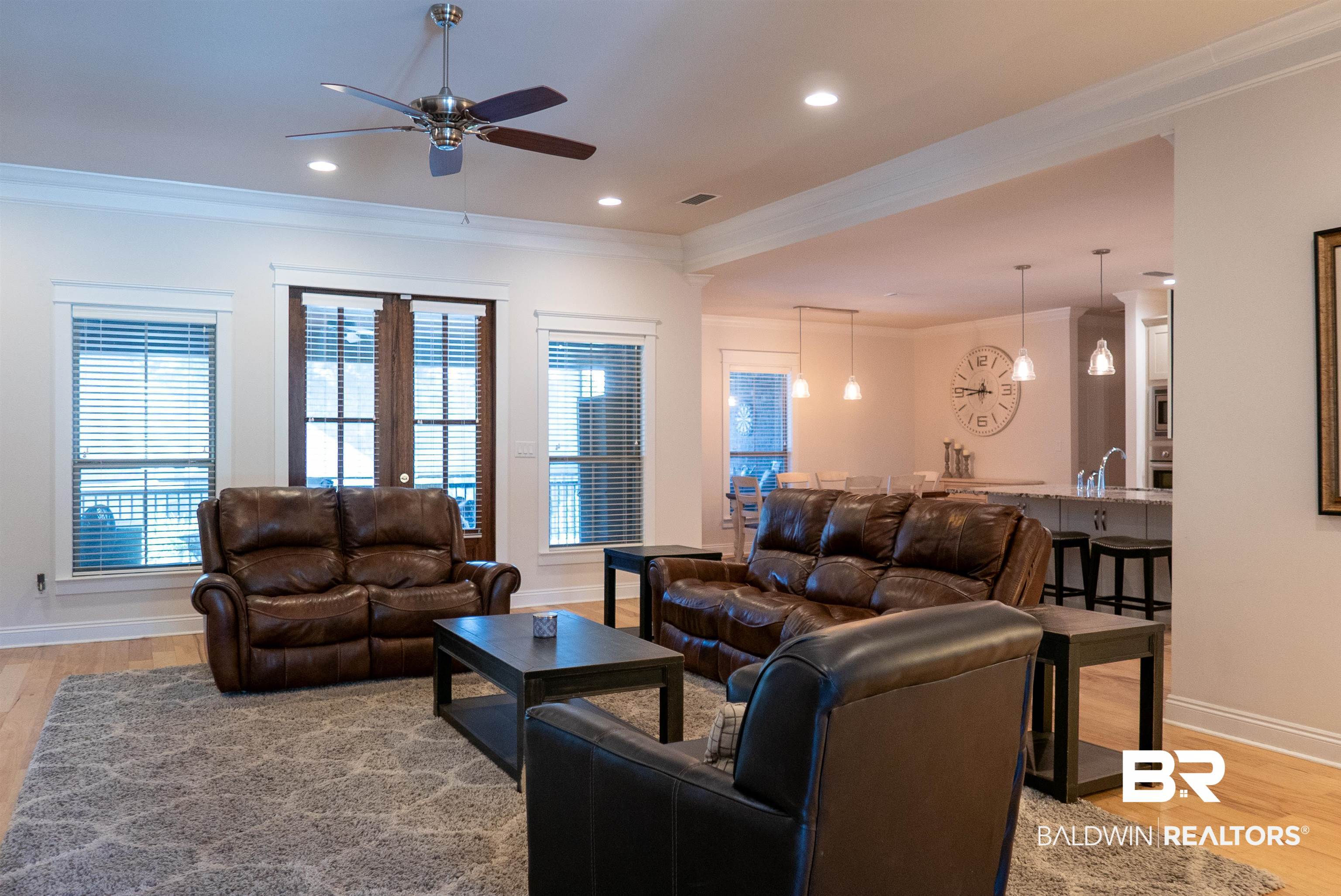 6684 Garrison Drive Daphne, AL 36527 - Photo 31 of 35 Living room featuring french doors, light hardwood / wood-style flooring, sink, crown molding, and ceiling fan