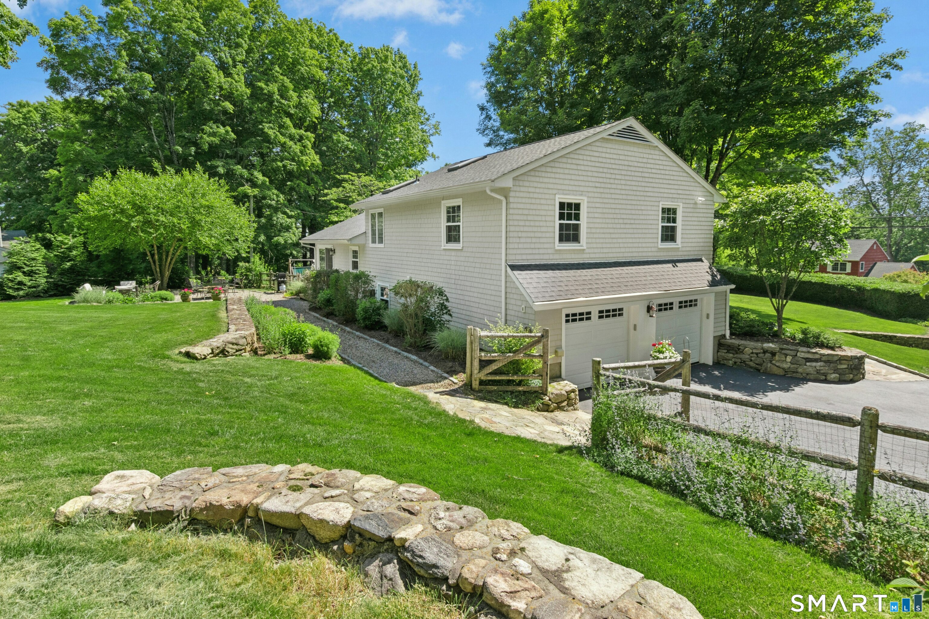 29 Old Farm Road Weston, CT 06883 - Photo 10 of 10 Even the garage side of the house is beautifully landscaped. This house is photogenic from every angle.