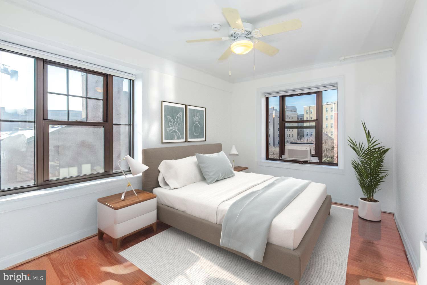 2100 19th Street Northwest, Unit 701 Washington, DC 20009 - Photo 10 of 24 a bedroom with a large bed couch and a window