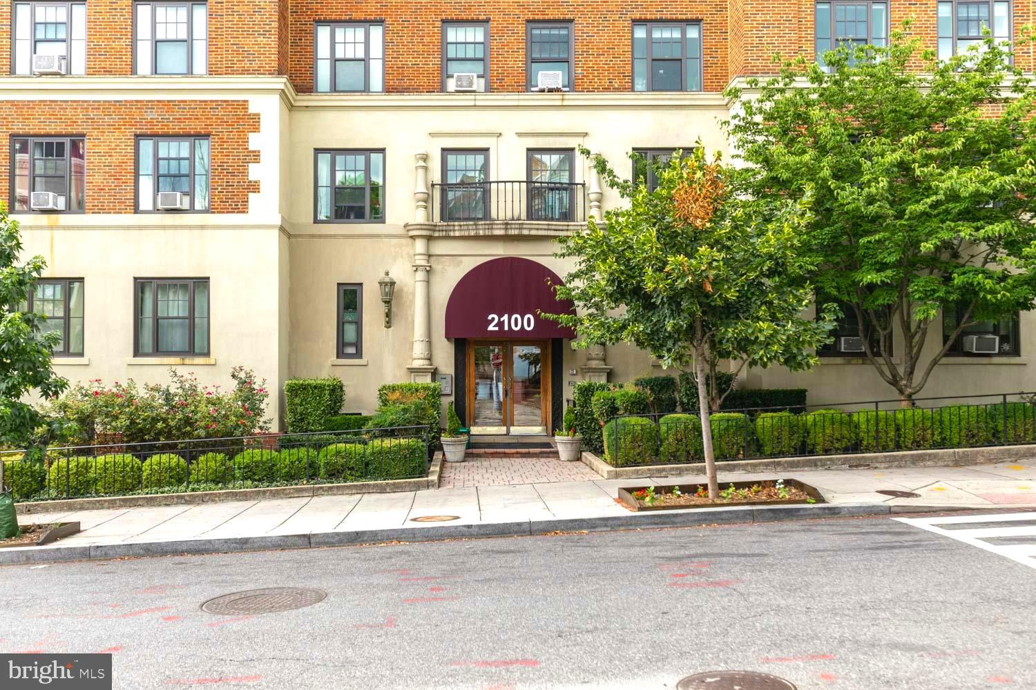 2100 19th Street Northwest, Unit 701 Washington, DC 20009 - Photo 18 of 24 front view of a brick house with a yard