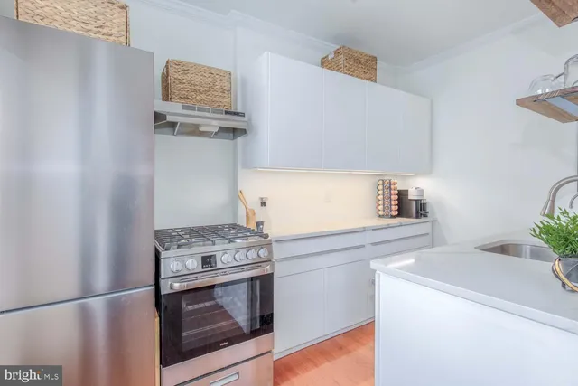 a kitchen with a stove and a microwave