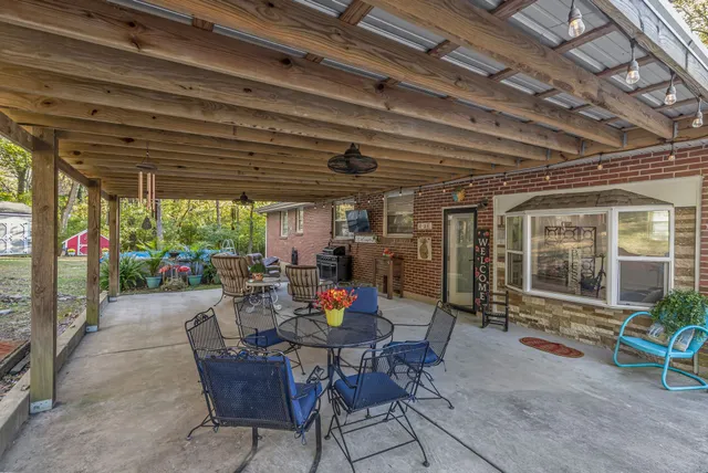 a view of a house with a porch patio and furniture