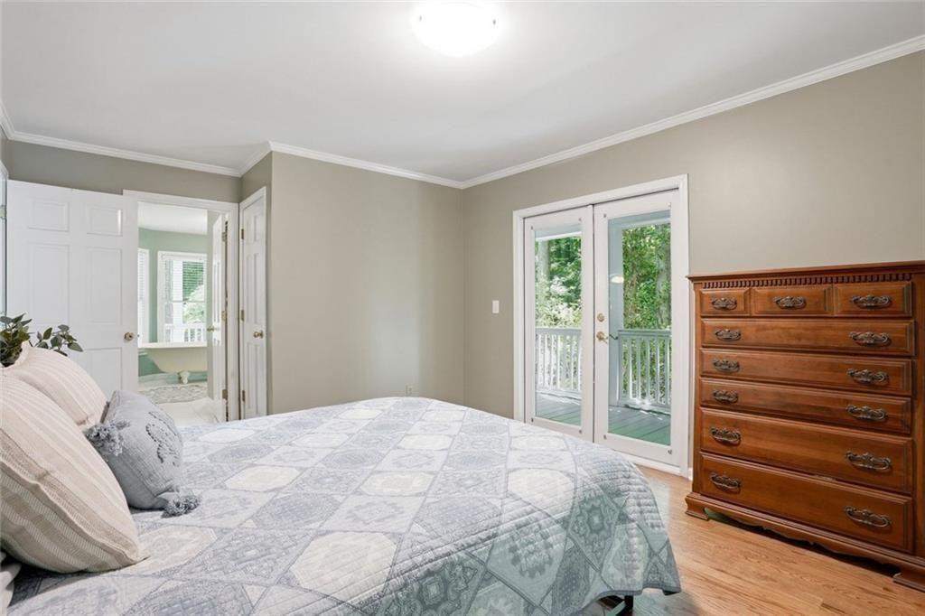 3259 Etchison Road Loganville, GA 30052 - Photo 19 of 50 a bedroom with a bed and a dresser