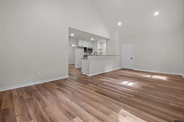 a view of a kitchen with wooden floor