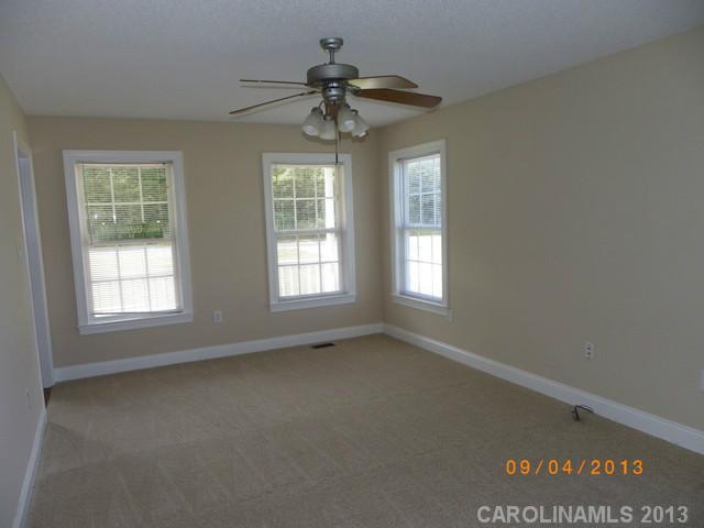 2210 Cedar Road York, SC 29745 - Photo 2 of 11 an empty room with a window
