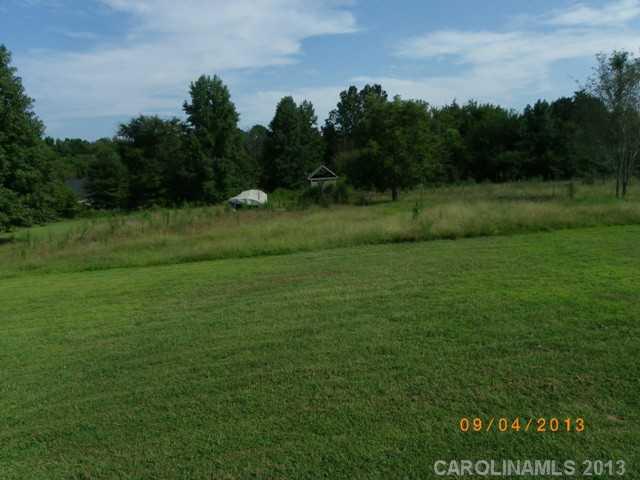 2210 Cedar Road York, SC 29745 - Photo 11 of 11 a view of a field of grass and trees