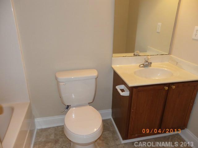 2210 Cedar Road York, SC 29745 - Photo 8 of 11 a bathroom with a toilet sink and mirror