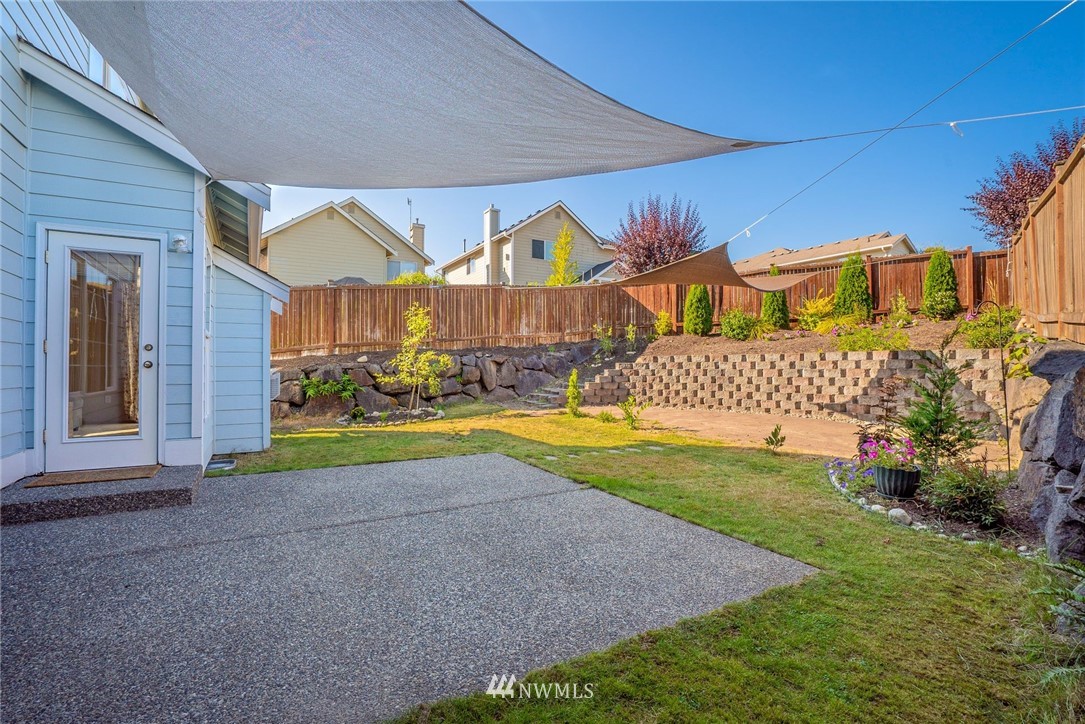 18469 Rainier View Road Southeast Monroe, WA 98272 - Photo 20 of 22 a view of a house with a swimming pool