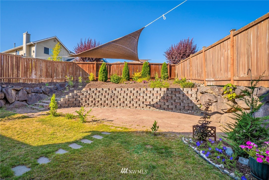 18469 Rainier View Road Southeast Monroe, WA 98272 - Photo 21 of 22 a view of a house with a yard