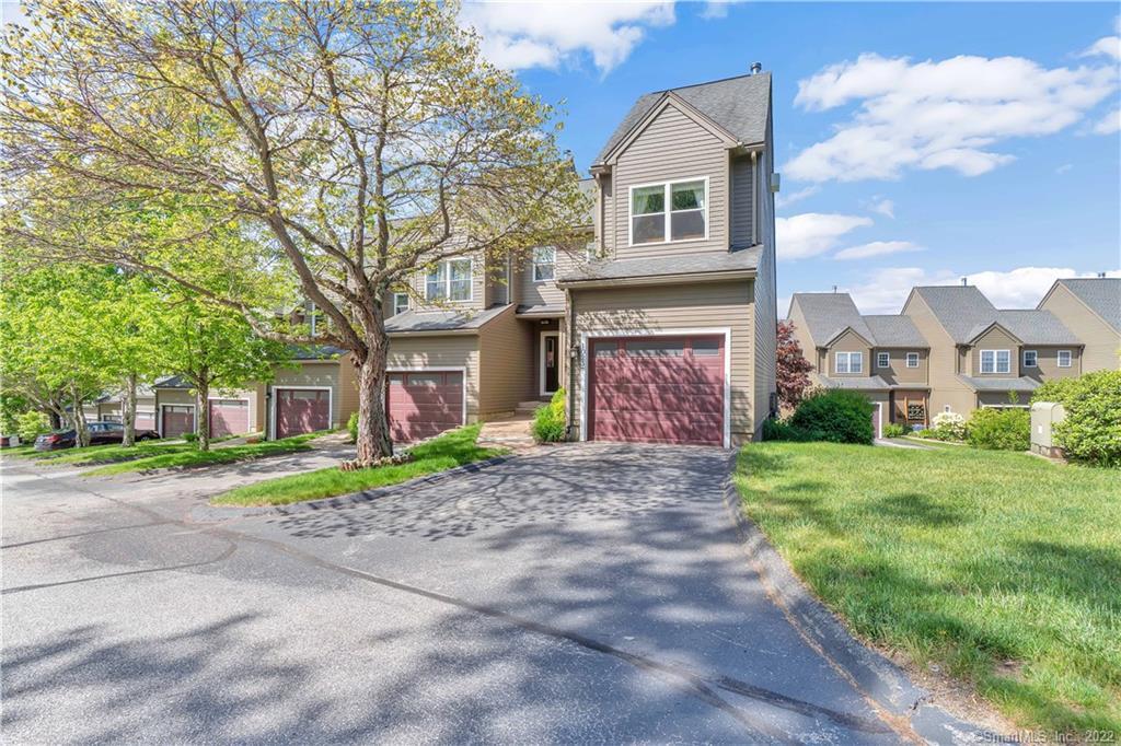 10 Depot Road, Unit 23 Willington, CT 06279 - Photo 1 of 1 a front view of a house with a yard and garage