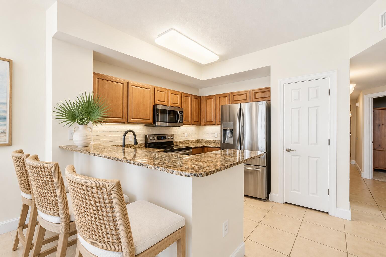 14825 Front Beach Road, Unit 2102 Panama City Beach, FL 32413 - Photo 9 of 38 Sunlit Coastal Kitchen with Woven Bar St