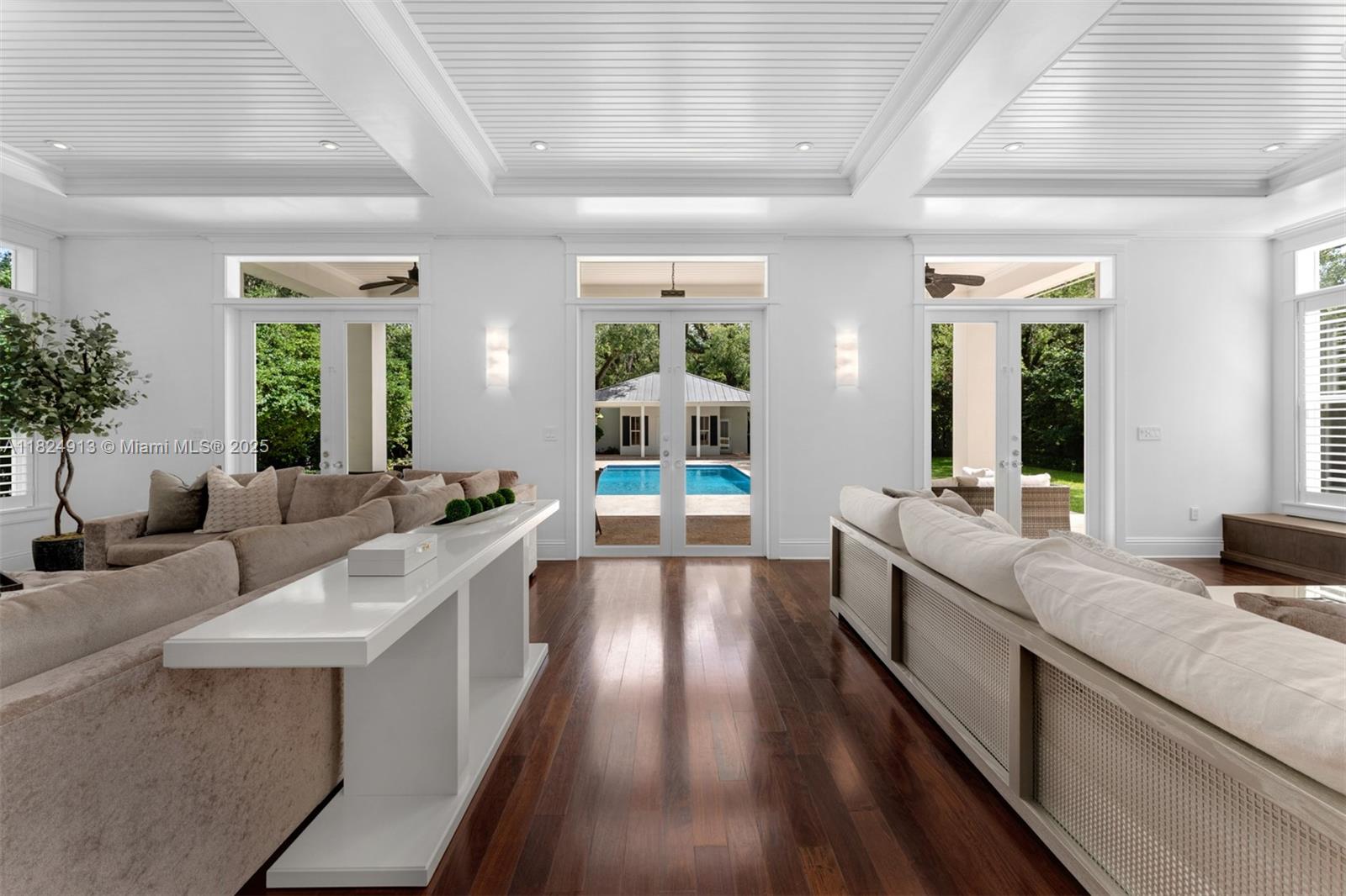 7415 Southwest 49th Place Miami, FL 33143 - Photo 14 of 60 a large white room with a large window and furniture
